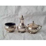 A small three piece cruet, half fluted, Birmingham 1913, two B.G.L's