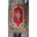 Red ground Oriental rug 46in x 72in