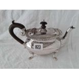 An oval teapot with gadroon rim on paw feet, 10” over handle, marks rubbed by Walker & Hall, 510 g