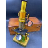 Brass mounted microscope in mahogany box with reflectors