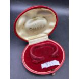 A ladies red Omega watch box