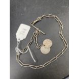 An antique silver watch Albert with two coin fobs