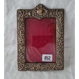A Victorian embossed photo frame with pierced decoration, arch top, 8” high, Birmingham 1898