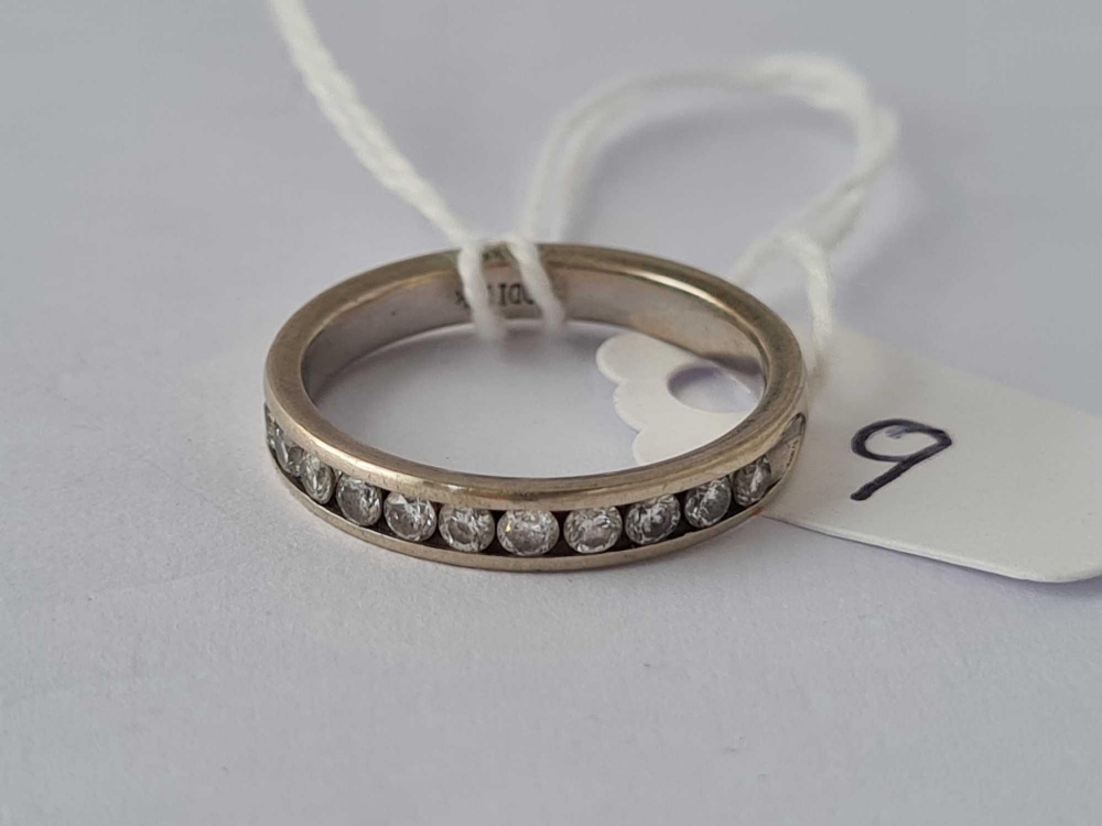 A WHITE GOLD DIAMOND HALF-ETERNITY RING, 14ct, size N, 3.3 g.