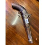 Antique percussion pistol with engraved decoration