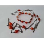 A bug of silver and carnelian jewellery