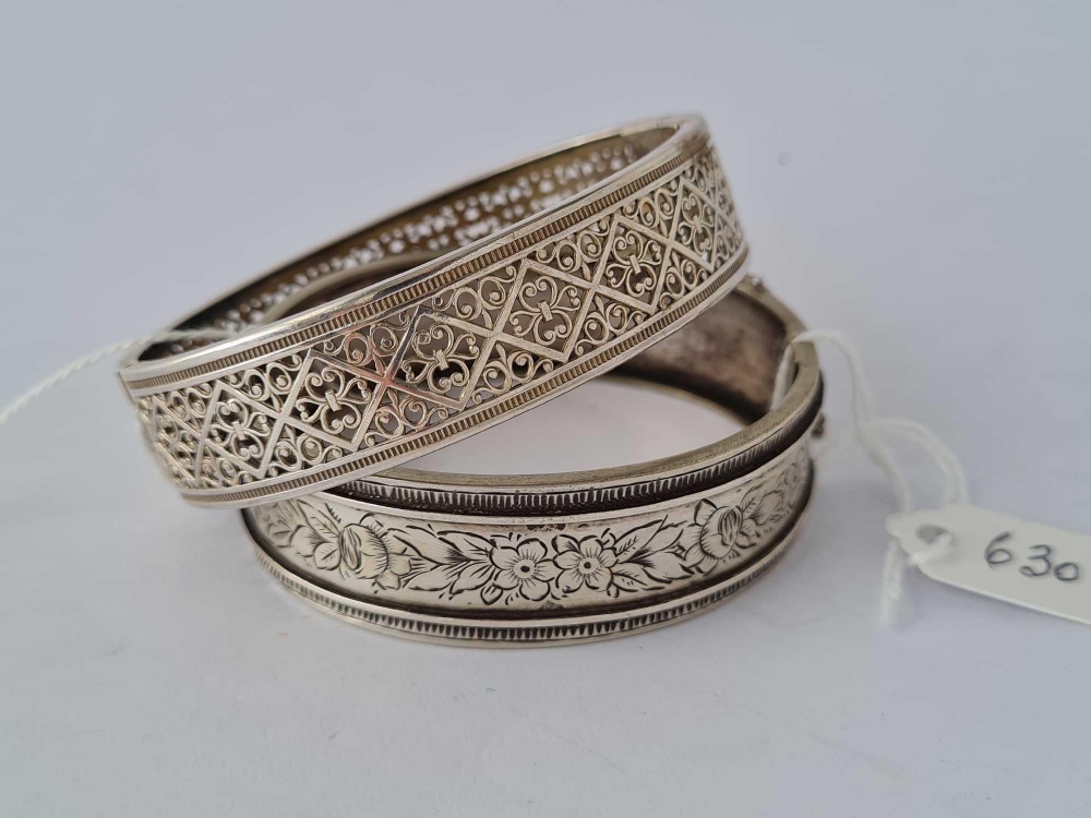 Two white metal wide bracelets