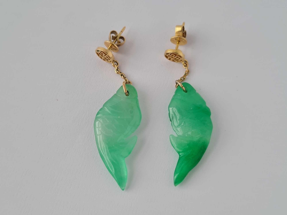 A pair Chinese gold and jade fish design earrings, 14ct