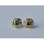 A pair of emerald ear studs 9ct