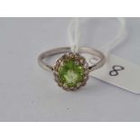 A white gold diamond and peridot ring, 18ct, size P, 3.2 g.