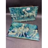 Pair of Green glazed tiles decorated in relief with figure 14 inch long