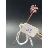 Antique flat cut garnet and pearl flower head stick pin