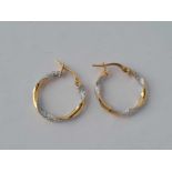 A pair of 2 colour 9ct gold & diamond twist hoop earrings