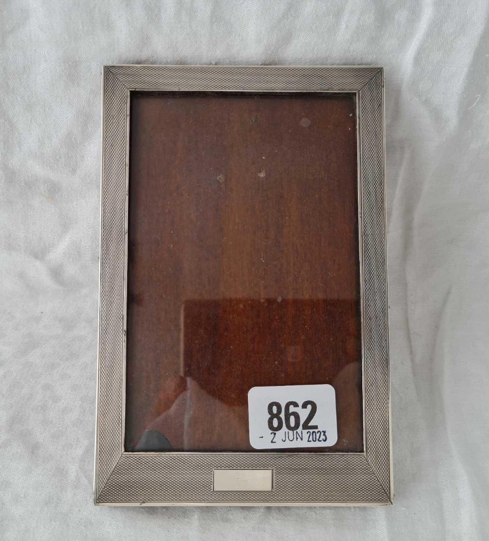 A good rectangular photo frame with engine turned boarder, easel back, 6.5" high, Birmingham 1937 by