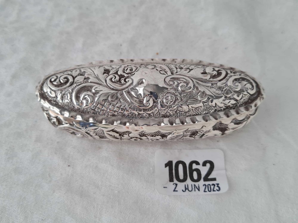 An oval embossed box with hinged cover, 4” wide, Birmingham 1900