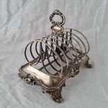 A heavy William IV toast rack on scroll feet, 8" long, London 1836 by JA, JA, 490g