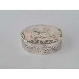 An oval pill box embossed with two infants, 1.75” wide, Import mark for London 1900
