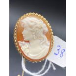 Good quality Cameo pendant/ brooch in fancy frame 9ct with safety chain