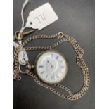 A ladies silver fob watch on silver chain and key