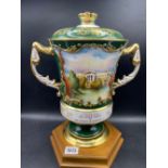 An Aynsley vase and cover painted with view of Buckingham Palace, 13" high including plinth