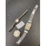 A silver and marcasite ladies watch and two others