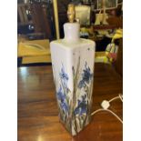 A large pottery lamp painted with an Iris, 18" high