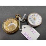 A ladies silver fob watch and a metal example