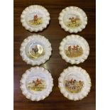 A set of six Royal Crown Derby plates, the centres with Hunting scenes, jewelled boarders, 10"