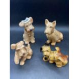A collection of four brown Sylvac Scotty dogs, the tallest 5" high