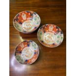 A graduated set of three late 19th century Imari bowls, the largest 9.5" diameter