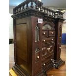 An attractive Victorian Gothic style cabinet with drawers and top gallery rail, 18" high