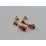 A pair of garnet drop earrings 9ct