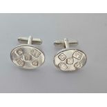 A good pair of hallmarked oval silver cufflinks