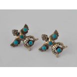 A pair of unusual silver and turquoise Aztec style earrings in form of warriors