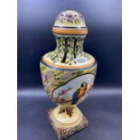 A Continental Urn shaped lamp painted with a bird, 14" high