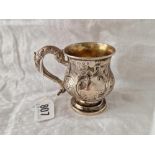 A Georgian Christening mug, lightly chased with scrolls & cast handle 3.5" high Sheffield 1828 85g