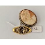 A stone set gilt oval fancy brooch and gilt oval cameo brooch