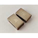 A pair of silver hallmarked matchbox holders, engine turned