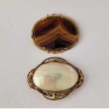 Two large gilt oval brooches MOP and agate