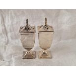 A pair of Urn shaped peppers on square pedestal bases, 3 1/4" high, Birmingham 1913, 90g