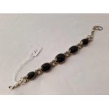 A ornate silver gem stone set bracelet 8 inches 27 gms