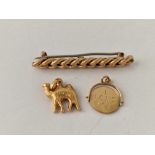 A 9ct curb link bar brooch and two gold charms 5.6 gms inc.