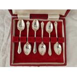 A boxed set of six coffee spoons with decorated stems, Sheffield 1938