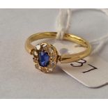 Antique Edwardian 18ct set with a KASHMIR oval sapphire and diamond cluster ring, size O