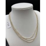 A Antique three row seed pearl necklace to platinum and gold barrel clasp 14 inch