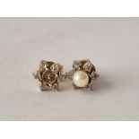 A pair of pearl and diamond earrings one pearl missing 18ct gold 2.6 gms
