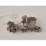 A silver and marcasite horse and carriage brooch