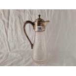 An Edwardian claret jug with hinged cover and cut glass body, 11” high, Sheffield 1909 by JD & S