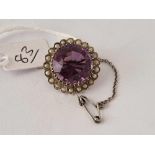 A silver amethyst and pearl brooch