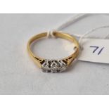 A diamond three stone ring in 18ct gold size P 2.5g